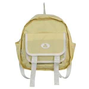 Cute Japanese style mini yellow backpack with white straps and front pocket for daily casual use.