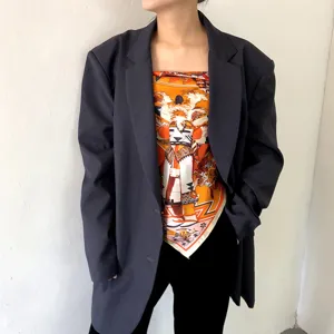 Luxurious mulberry silk square scarf styled with an oversized blazer for a chic, elegant look.