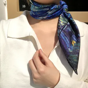 Detailed view of the silk square scarf featuring a classic starry night artistic oil painting print.