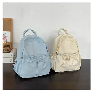 Koreaanse stijl nylon rugzak met schattige strik, lichte casual schooltas voor dagelijks gebruik.