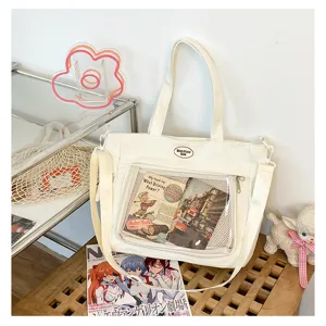 Sac cabas en toile blanche avec fenetre transparente, grand sac bandouliere pour usage quotidien.