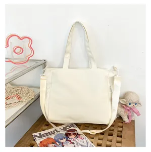 Sac cabas en toile de grande capacité style japonais mignon bandoulière pour étudiants.