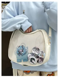 White transparent ita bag shoulder crossbody bag with clear display pocket for anime merchandise.