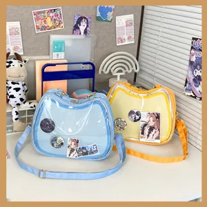 Clear window cat ita bag for pins and badges, canvas shoulder crossbody bag in blue and yellow colors.