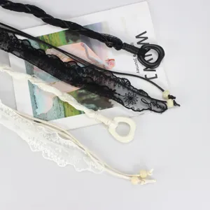 Detailed view of women braided lace waist chains set, black and white fashion belt accessories.