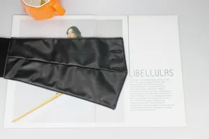 Black wide waist belt for women, elastic PU leather corset cinch for dresses and suits.