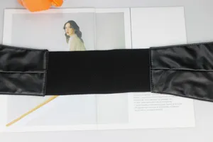 Black wide elastic corset belt detail, PU leather ends, stylish dress cincher waist accessory.