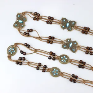 Bohemian handmade rhinestone butterfly waist chain with wooden beads and waxed rope design.