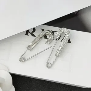 Rhinestone safety pin brooch for waist adjustment and clothing decoration, silver tone.