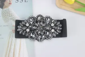 Black elastic wide waist belt detail, featuring a stunning crystal rhinestone floral buckle.