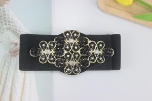 Wide elastic waist belt for women with black crystal rhinestone floral decorative buckle dress.