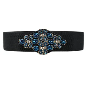 Women's wide elastic waist belt with sparkling crystal rhinestone floral buckle for dresses.