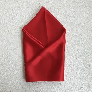 Red silk square scarf detail smooth texture fabric luxury accessory elegance classic style