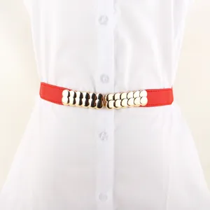 Red elastic waist belt for women with gold metal interconnected buckle for dresses.