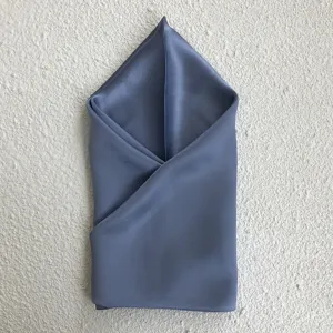 High-end mulberry silk square scarf in elegant grey blue, showcasing smooth texture detail.