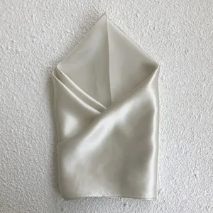 Elegant solid color silk square scarf detail shot, premium mulberry silk neckerchief accessory.