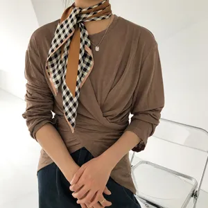 Luxury silk plaid scarf with classic British style, elegant neck accessory for modern women.