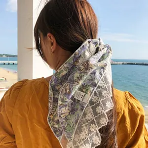 Spring small floral lace hair scarf detail view, fresh girlish style decorative accessory.