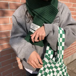Green knitted scarf winter warm thick knit scarf stylish design fashion accessory detail view