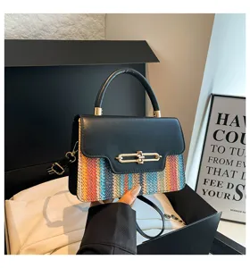 Stylish women colorblock shoulder bag with metal lock top handle fashion handbag.
