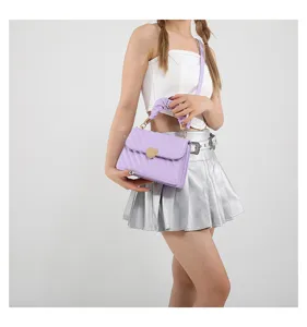 Chic light purple small square bag featuring a cute heart-shaped lock and stylish pleated handle.