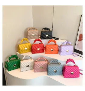 Trendy small square shoulder bag with cute ruffled handle and heart clasp for women daily use.