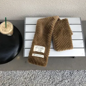 Brown fluffy plush winter scarf with English label decoration, warm and stylish neck warmer.