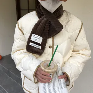 Winter plush brown scarf with chic fabric label, soft and warm fashion accessory for women.