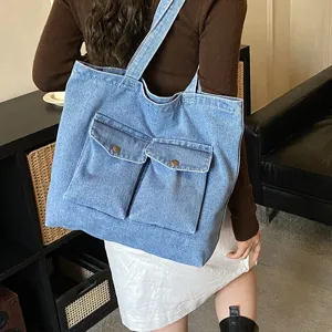 Large capacity denim tote bag for women, casual single shoulder commuting bag with pockets.
