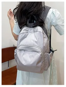 Stylish casual silver backpack for women and students, perfect for daily commute and school use.
