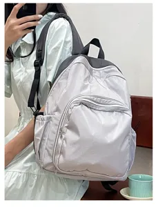Casual light grey backpack with multiple zipper pockets for daily commute and students.