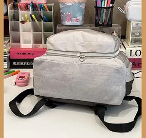 Casual gray student backpack with heart zipper pull, perfect for daily commute and school use.