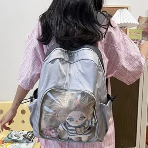 Gray clear window ita backpack for women, casual student school bag with plush doll display.