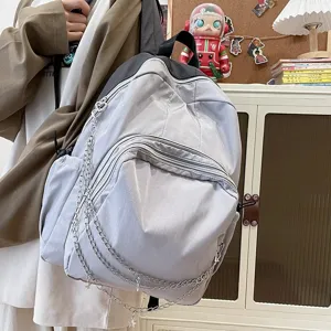 Casual multi-pocket grey backpack with chic metal chains for stylish student daily commute.