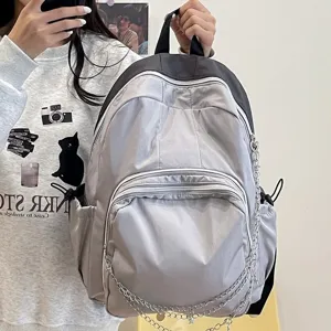 Stylish casual grey backpack for women and students with chain strap for daily commute.