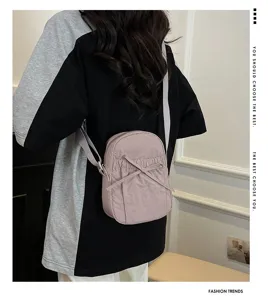 Casual waterproof nylon bow crossbody bag detail, lightweight daily shoulder purse.