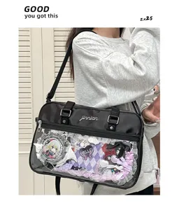 Black JK ita bag detail shot, transparent pocket with anime badges and lace trim, stylish.
