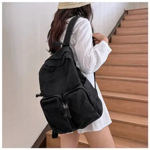 Casual black denim backpack for daily school and travel, showcasing detailed side and back view.