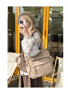 Bolso bandolera de lona informal para estudiantes, bolsa escolar duradera con varios bolsillos.