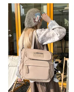 Bolso bandolera de lona casual con múltiples bolsillos y bonito colgante para estudiantes.