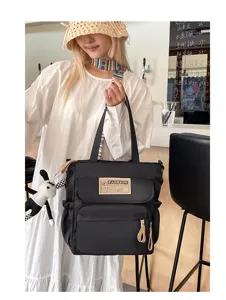 Bolso bandolera de lona negra bolso tote informal de estudiante con múltiples bolsillos