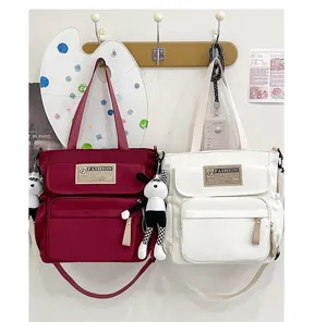 Bolso bandolera de lona para estudiantes, bolsa de libros grande práctica con bonito colgante.