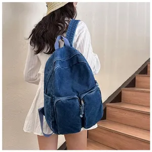 Detailed view of casual retro denim backpack for daily student use, vintage style.