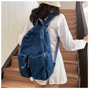 Detailed view of the casual denim backpack in daily lifestyle setting showing the back design.