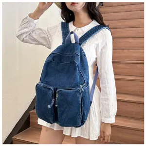 Classic casual blue denim school backpack with multiple functional front pockets.