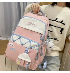 Mochila escolar rosa y blanca con gran capacidad y diseño tierno para el uso escolar diario.