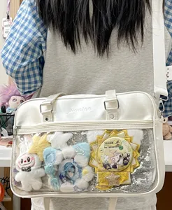 White PU leather Japanese JK ita bag with clear window pocket for pins, badges, and anime plush.