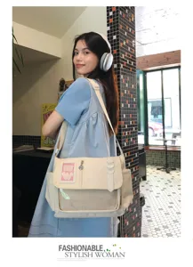 Detailed view of Japanese style canvas ita shoulder bag with cute transparent pocket design.