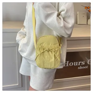 Japanese style waterproof nylon crossbody bag with bow, lightweight casual shoulder phone bag for women.