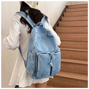 Vintage denim casual backpack for students, stylish daily school bag with multiple pockets.